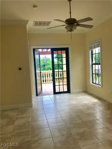 a view of an empty room with a window