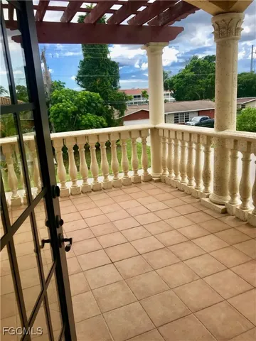 a view of balcony with wooden floor
