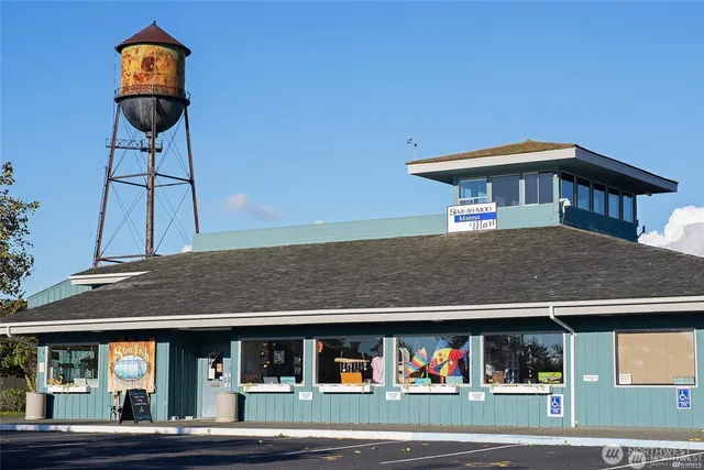 a view of a house with a porch and furniture
