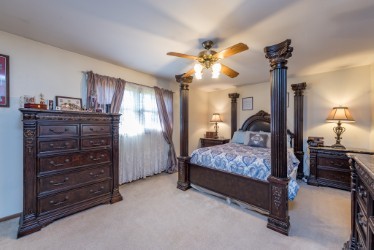 724 Roberts Road Winthrop Harbor, IL 60096 - Photo 12 of 31 a bedroom with a bed and furniture
