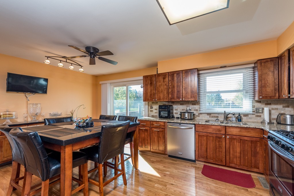 724 Roberts Road Winthrop Harbor, IL 60096 - Photo 4 of 31 a kitchen with a sink stove and cabinets
