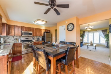 724 Roberts Road Winthrop Harbor, IL 60096 - Photo 5 of 31 a view of a dining room with furniture window and wooden floor