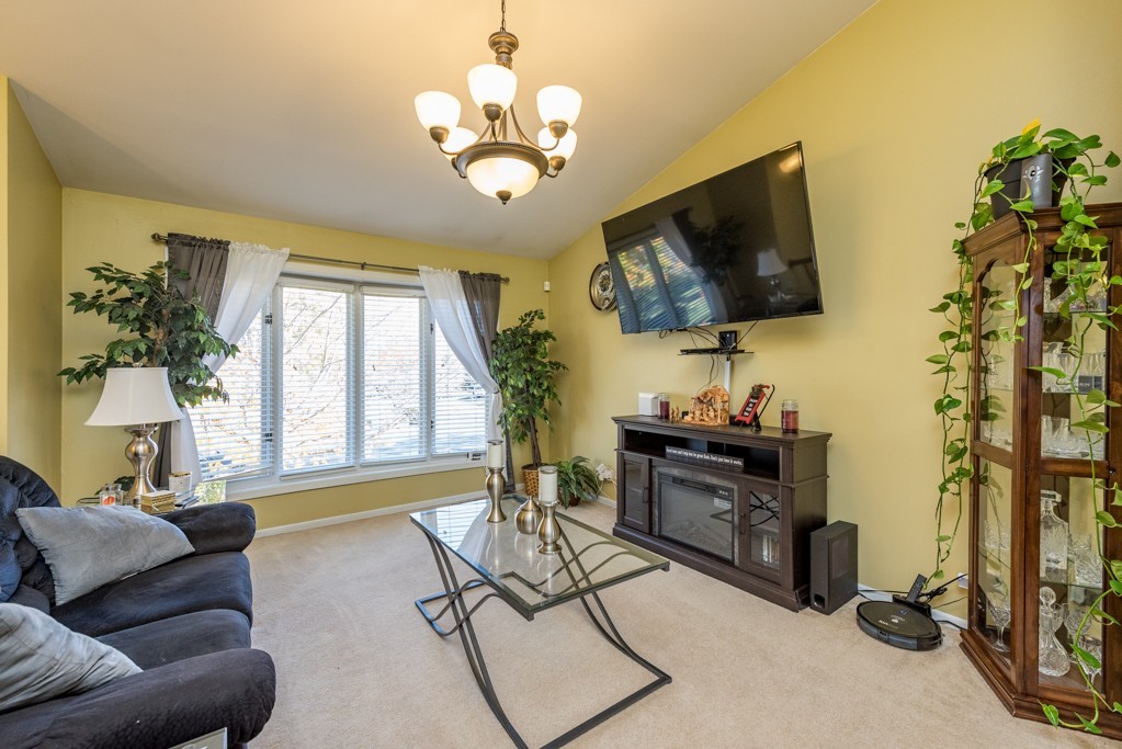 724 Roberts Road Winthrop Harbor, IL 60096 - Photo 8 of 31 a living room with furniture and a flat screen tv