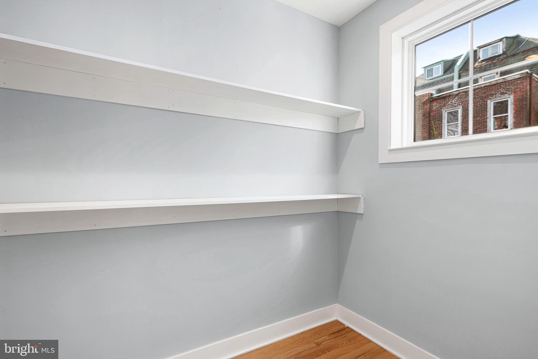 1124 Divinity Street Philadelphia, PA 19143 - Photo 11 of 37 a view of a small space with wooden floor and a window