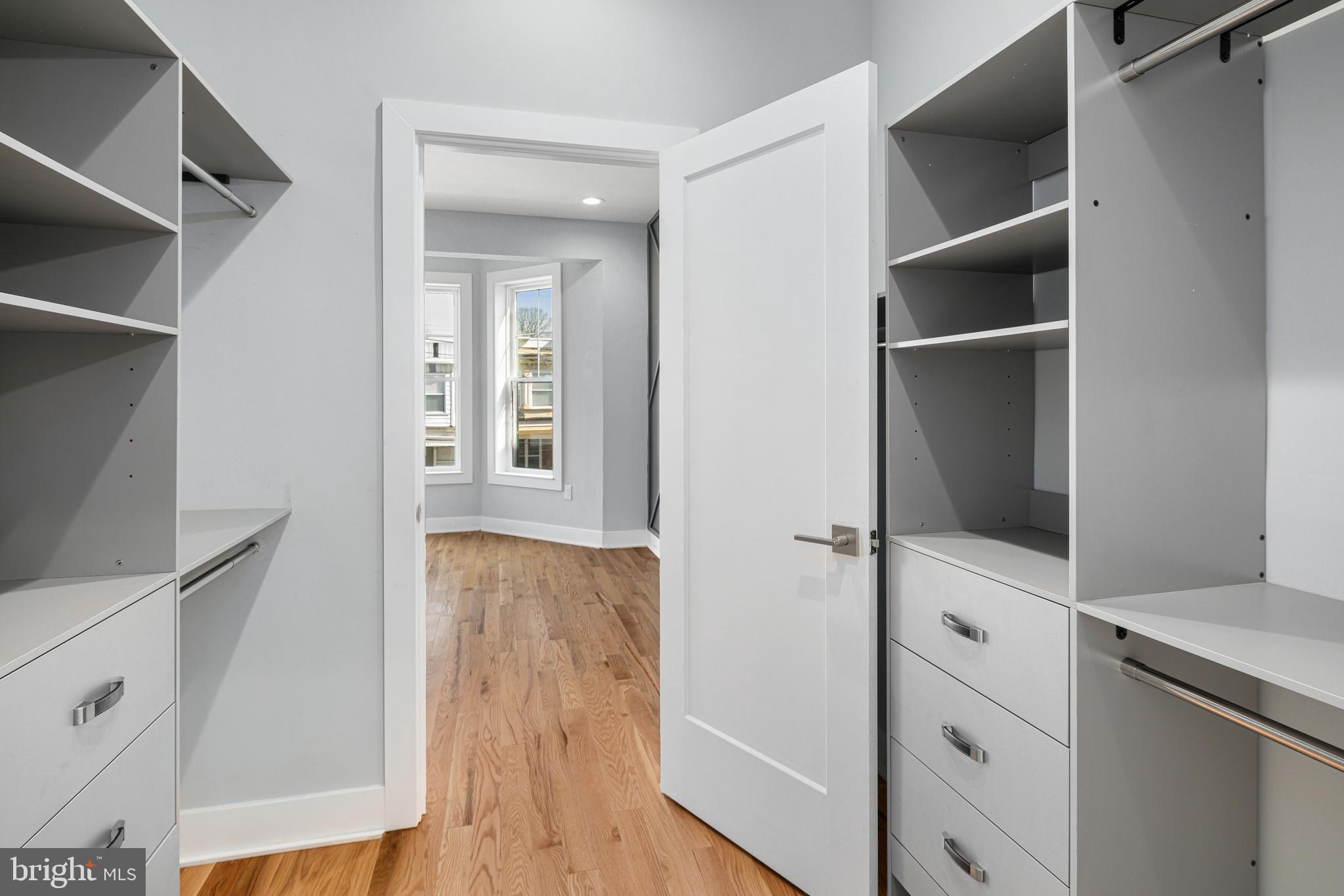 1124 Divinity Street Philadelphia, PA 19143 - Photo 16 of 37 walk in closet with wooden floor