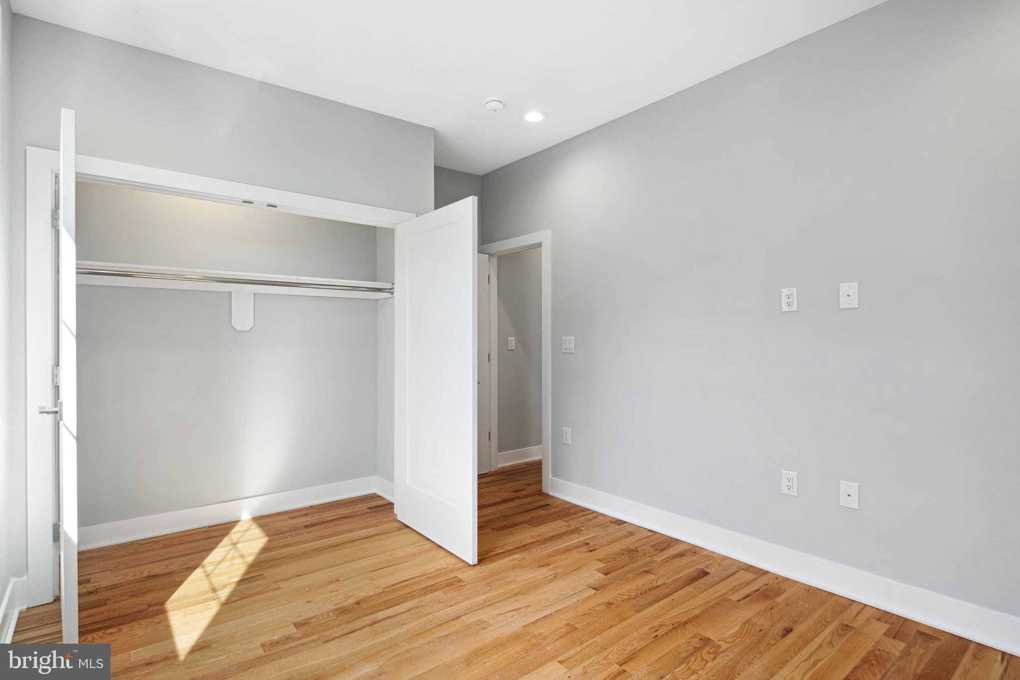 1124 Divinity Street Philadelphia, PA 19143 - Photo 24 of 37 a view of an empty room with wooden floor