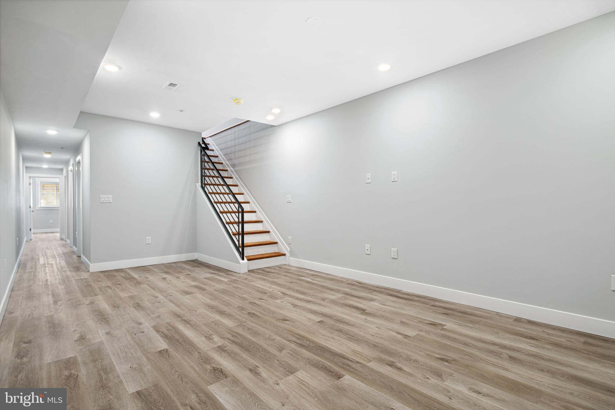 1124 Divinity Street Philadelphia, PA 19143 - Photo 27 of 37 a view of an empty room with wooden floor