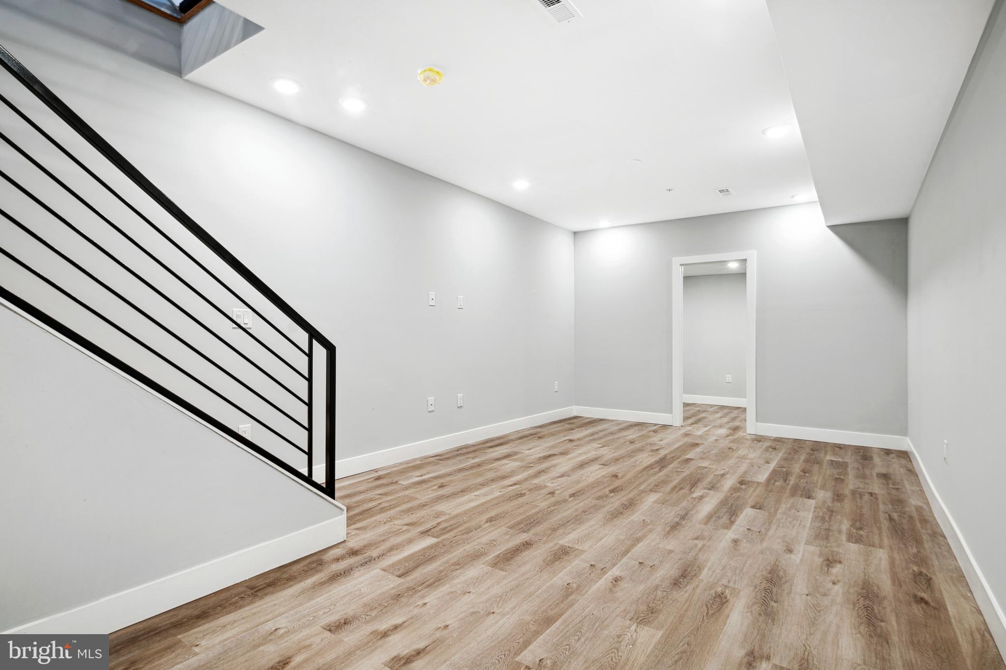 1124 Divinity Street Philadelphia, PA 19143 - Photo 28 of 37 a view of empty room with wooden floor