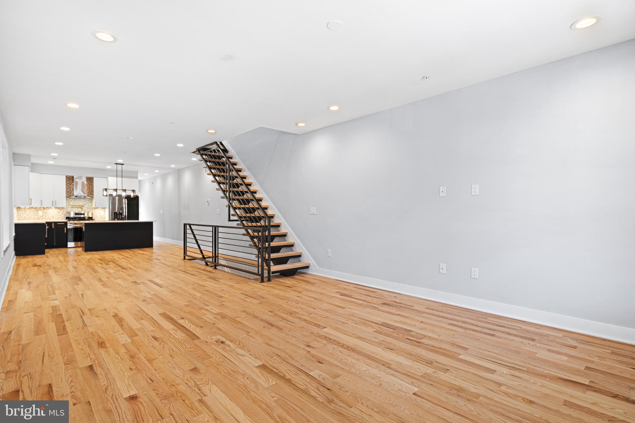 1124 Divinity Street Philadelphia, PA 19143 - Photo 3 of 37 a view of empty room with wooden floor