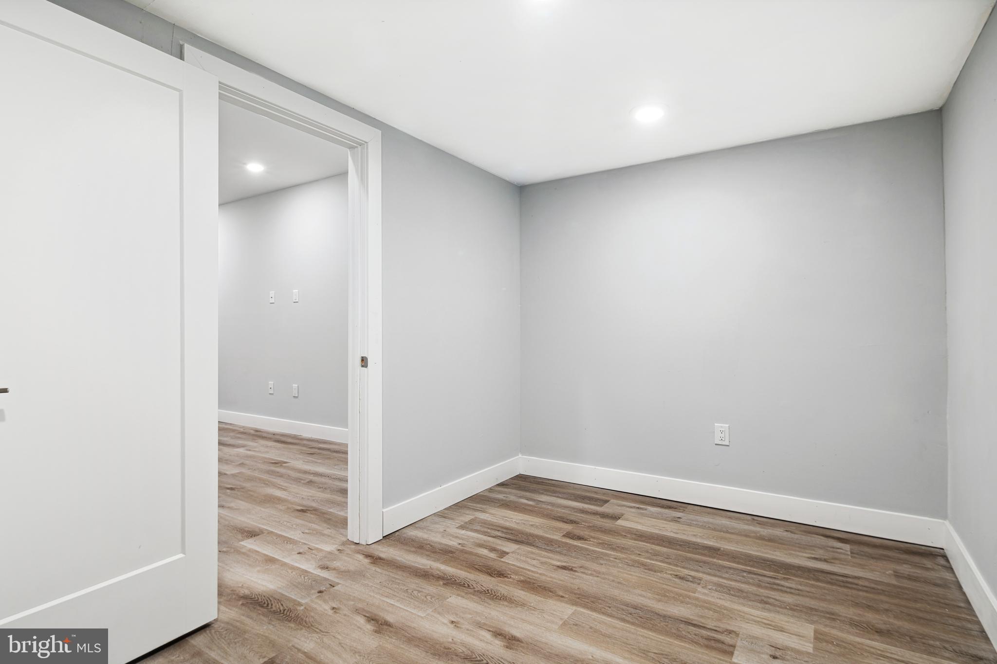 1124 Divinity Street Philadelphia, PA 19143 - Photo 31 of 37 a view of empty room with wooden floor