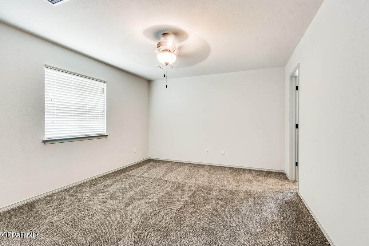 12420 Oconee Place Clint, TX 79836 - Photo 25 of 27 an empty room with a window