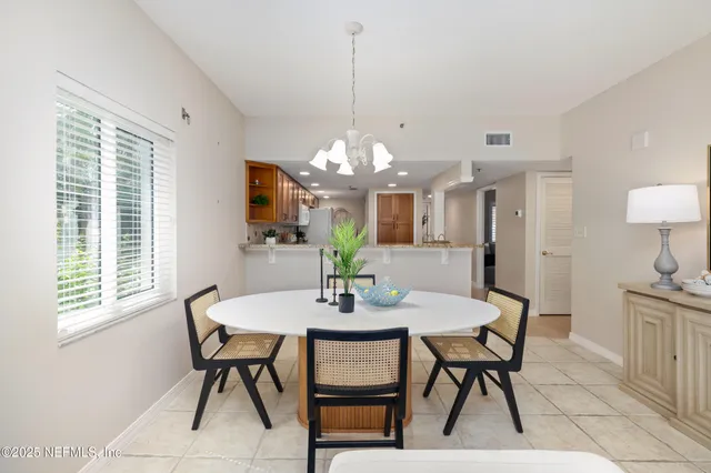 a view of a hallway with windows and stairs