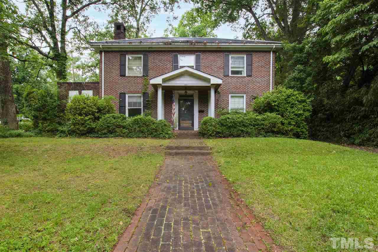 1805 St Marys Street Raleigh, NC 27608 - Photo 1 of 3 a front view of a house with yard and green space
