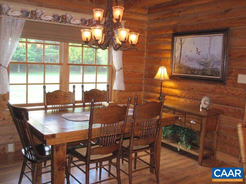 991 Sulphur Spring Road Prospect, VA 23960 - Photo 13 of 45 a view of a dining room with furniture a chandelier and wooden floor