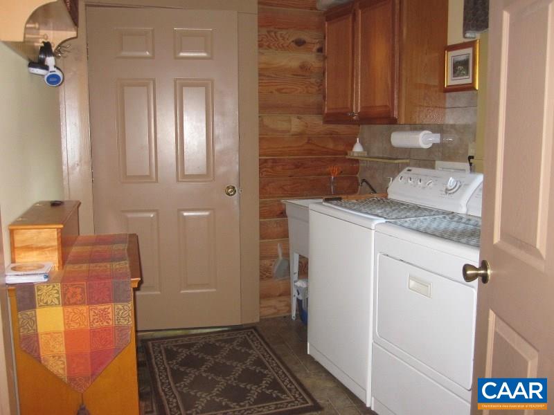 991 Sulphur Spring Road Prospect, VA 23960 - Photo 15 of 45 a bathroom with a granite countertop sink and a mirror