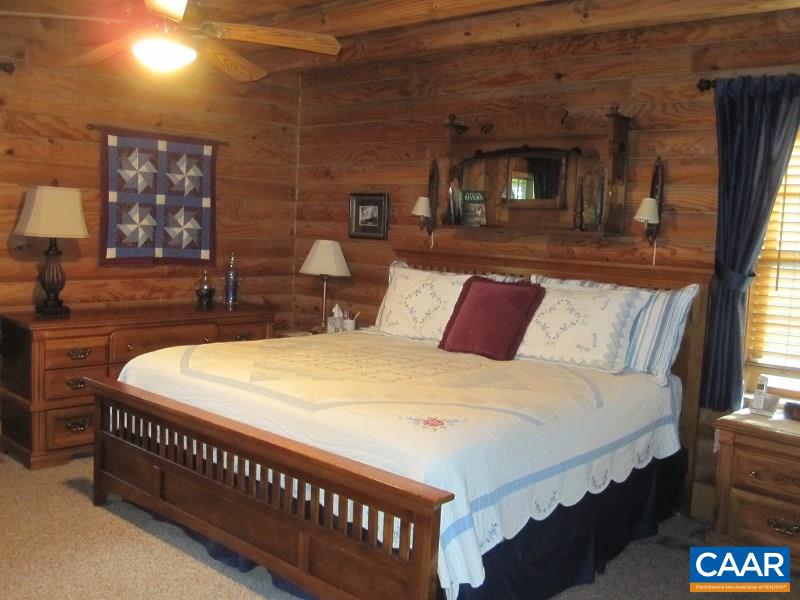 991 Sulphur Spring Road Prospect, VA 23960 - Photo 16 of 45 a bed sitting in a bedroom next to a larger window