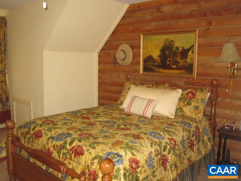 991 Sulphur Spring Road Prospect, VA 23960 - Photo 19 of 45 a bedroom with a bed and painting on the wall
