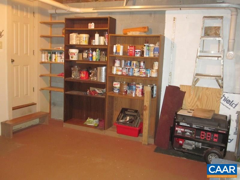 991 Sulphur Spring Road Prospect, VA 23960 - Photo 27 of 45 a living room with furniture a bookshelf and a window