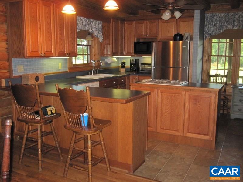 991 Sulphur Spring Road Prospect, VA 23960 - Photo 10 of 45 a kitchen with stainless steel appliances granite countertop a sink refrigerator and microwave