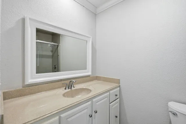 a bathroom with a shower and toilet