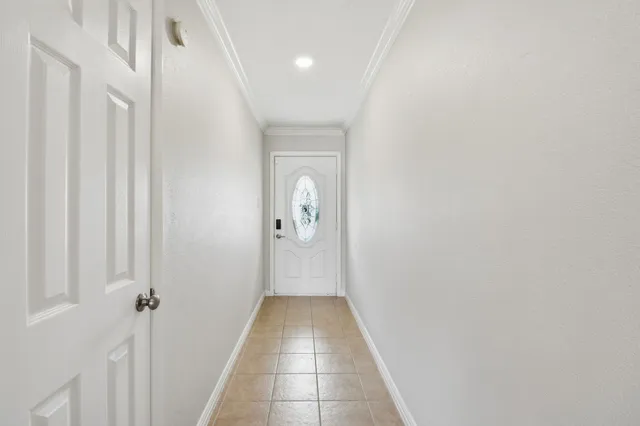 a view of a hallway with a white walls