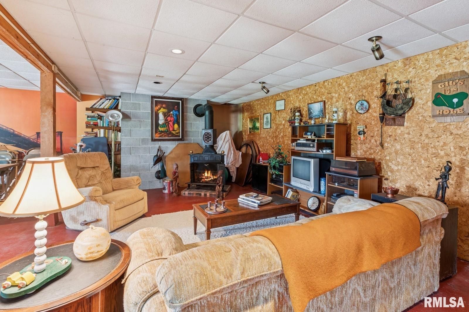 1825 5th Avenue South Clinton, IA 52732 - Photo 22 of 34 a outdoor living space with furniture and a flat screen tv