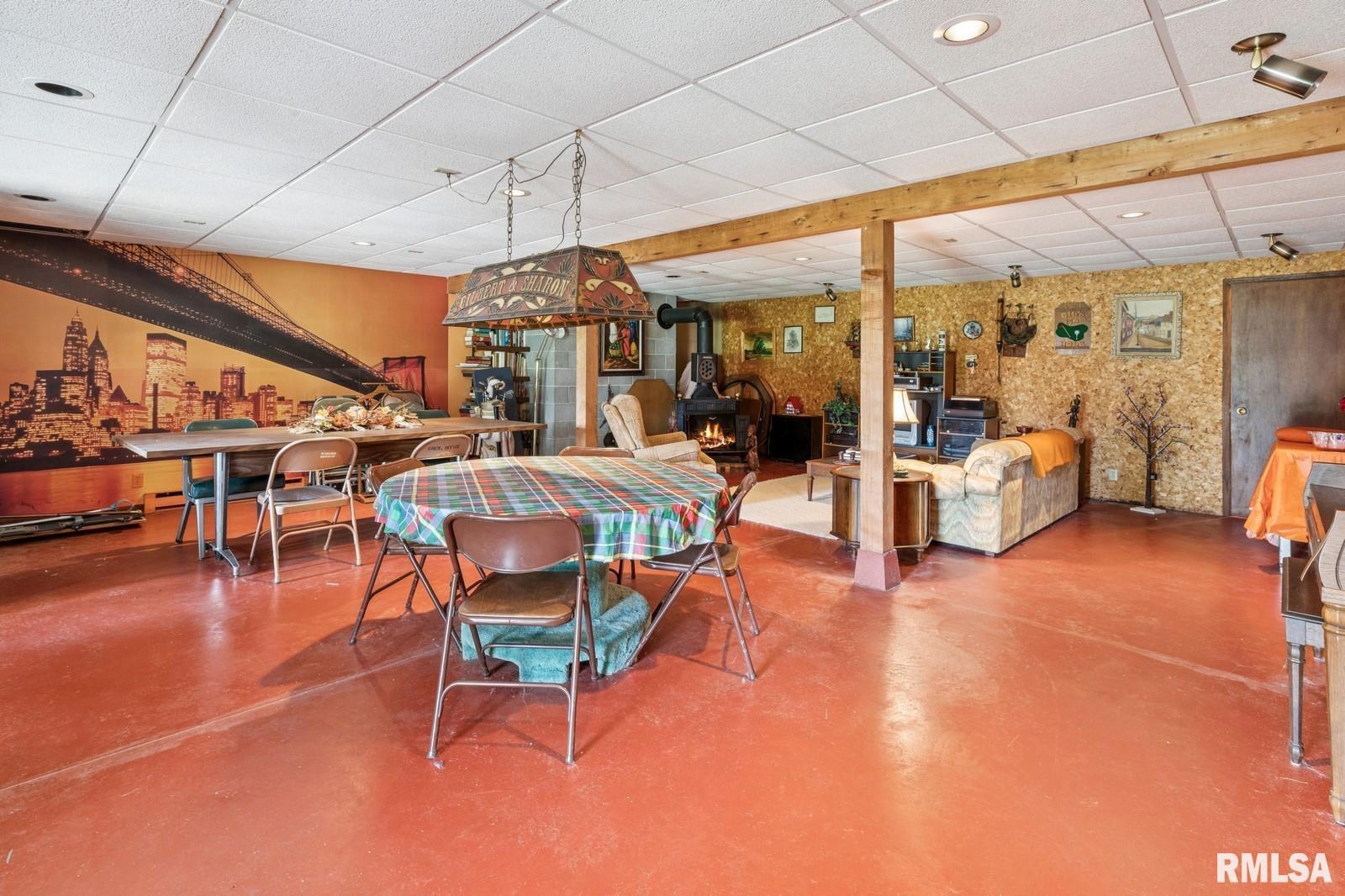 1825 5th Avenue South Clinton, IA 52732 - Photo 23 of 34 a living room with lots of furniture and a large window