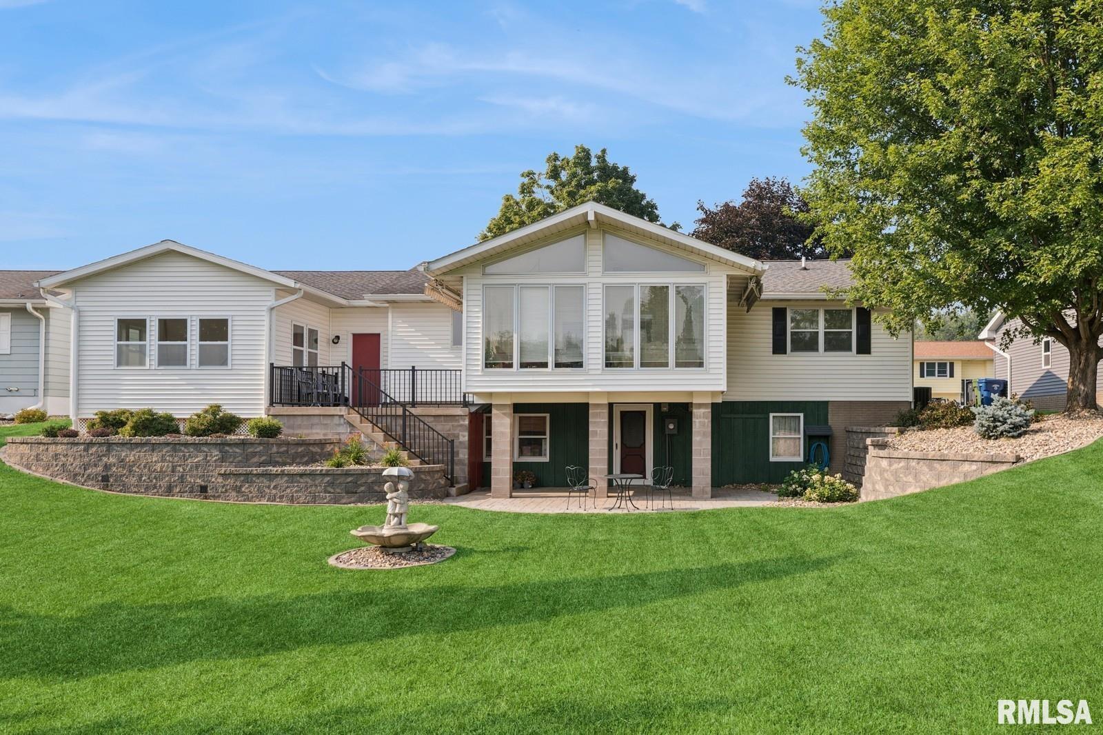 1825 5th Avenue South Clinton, IA 52732 - Photo 28 of 34 a front view of a house with a yard