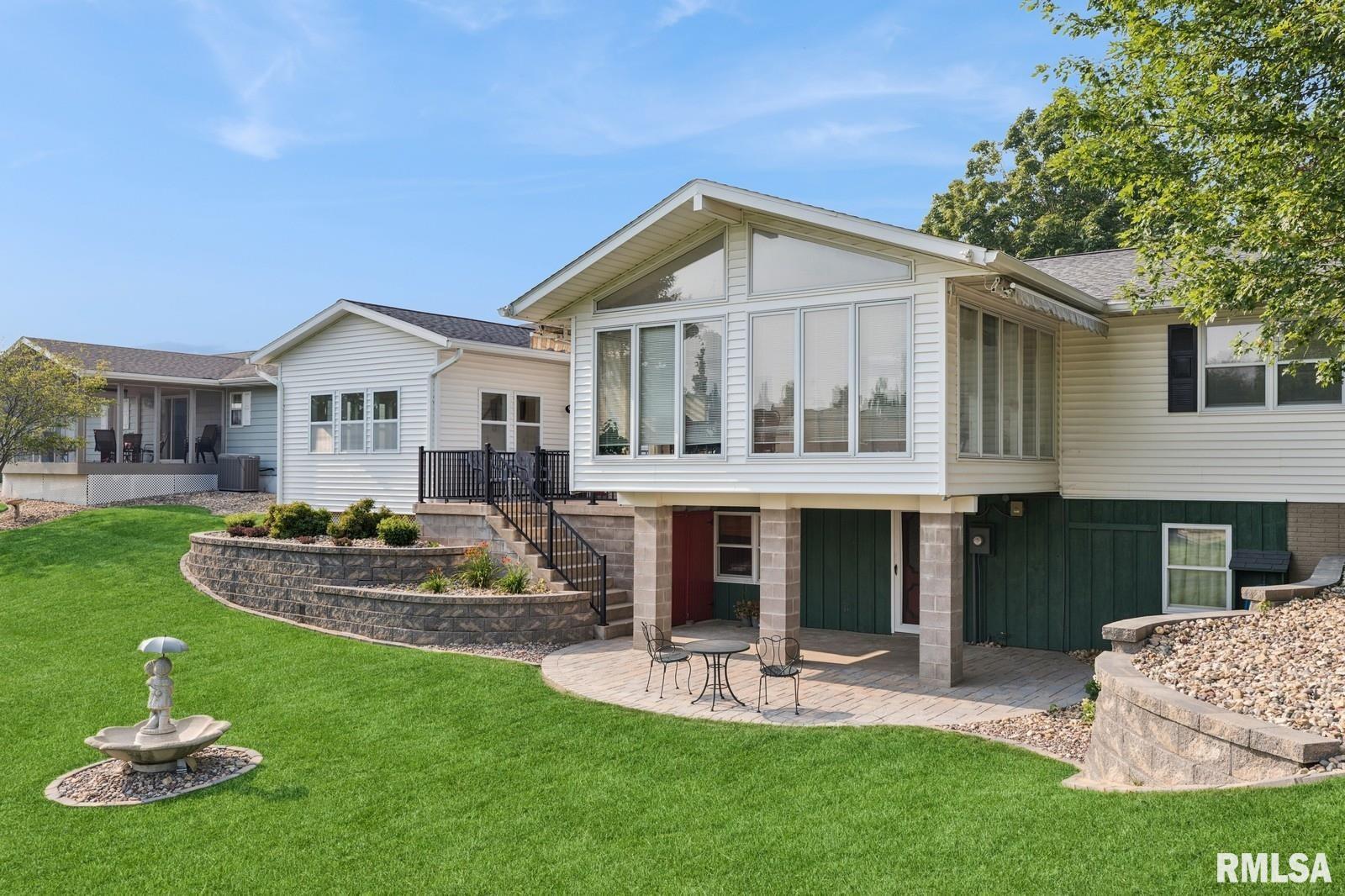 1825 5th Avenue South Clinton, IA 52732 - Photo 29 of 34 a front view of a house with a yard
