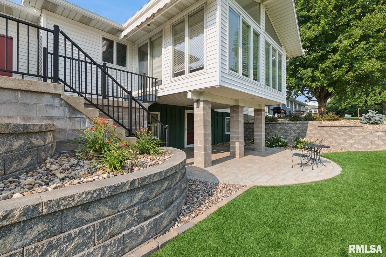 1825 5th Avenue South Clinton, IA 52732 - Photo 30 of 34 a view of an house with backyard porch and garden