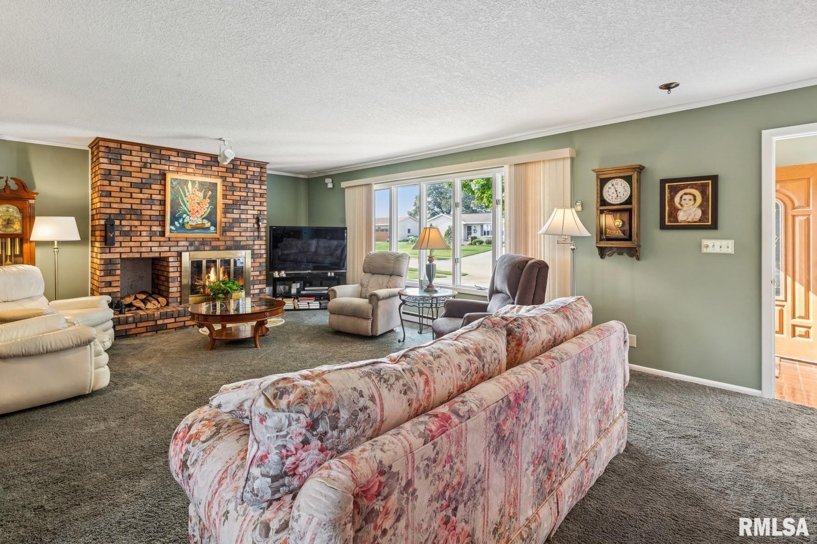 1825 5th Avenue South Clinton, IA 52732 - Photo 5 of 34 a living room with furniture and a large window