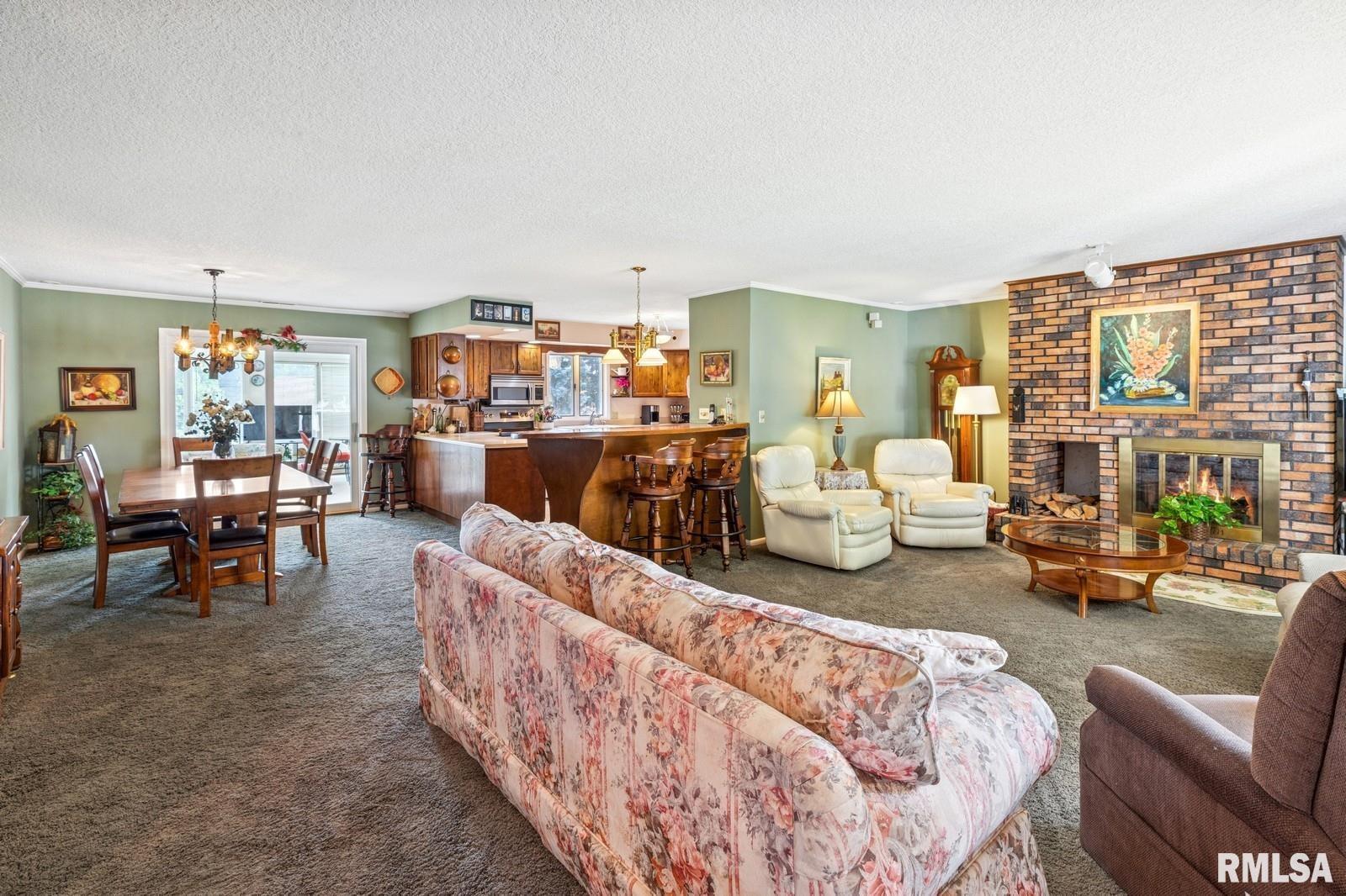 1825 5th Avenue South Clinton, IA 52732 - Photo 6 of 34 a living room with furniture and a large window