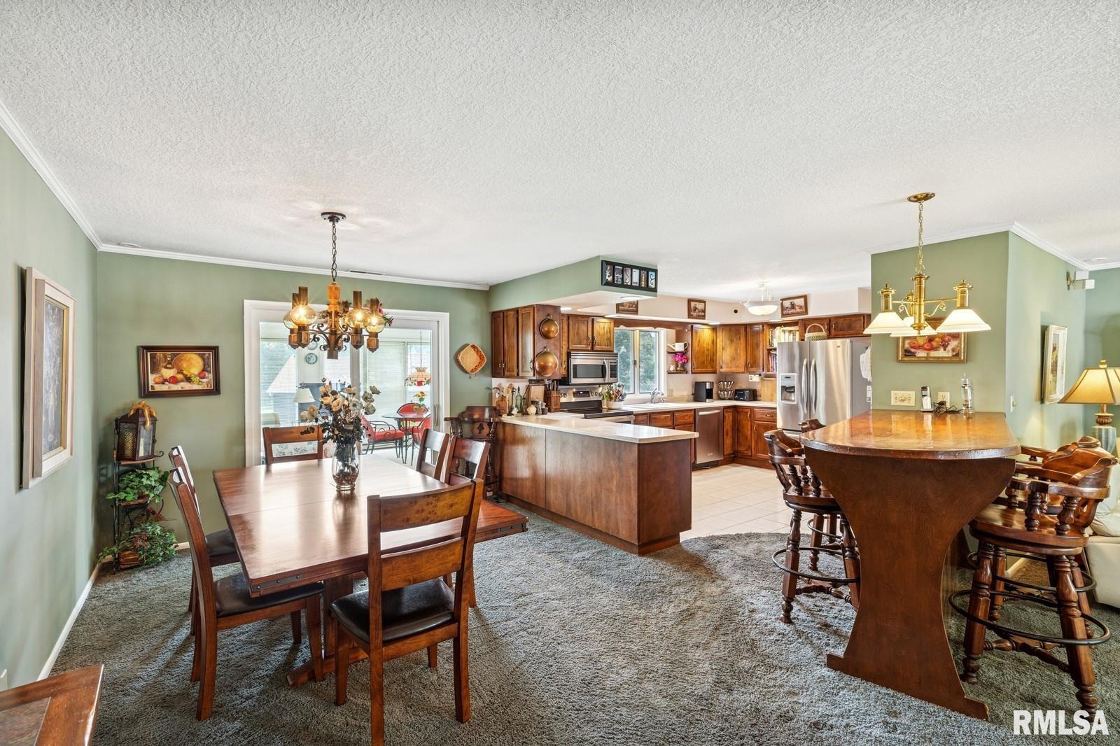 1825 5th Avenue South Clinton, IA 52732 - Photo 7 of 34 a living room with lots of furniture and kitchen