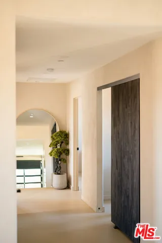 a view of livingroom with furniture and front door
