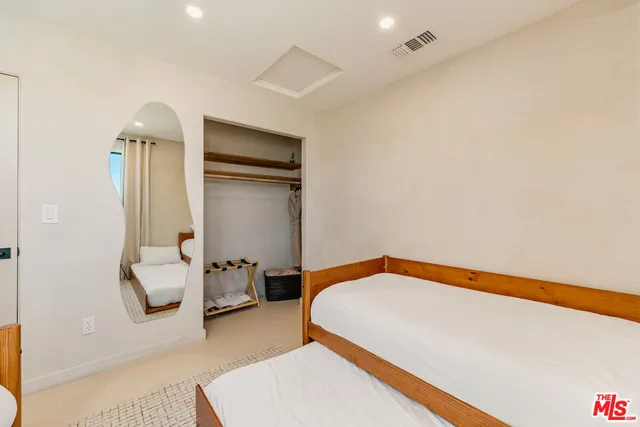 a bedroom with a bed and furniture