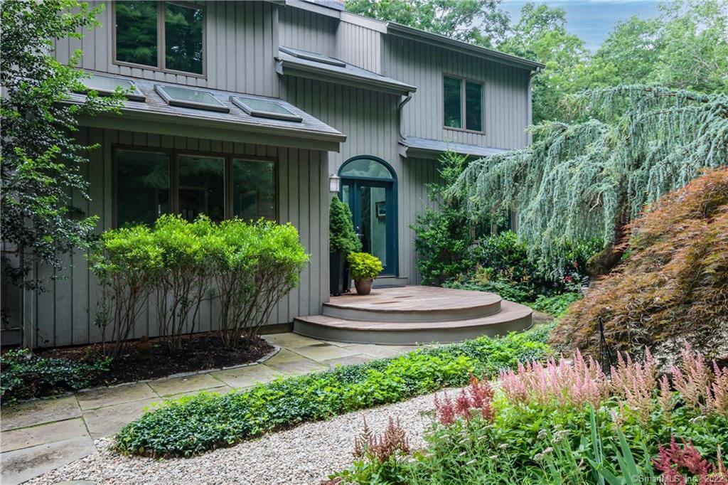 Professionally landscaped entry with beautiful and interesting plantings