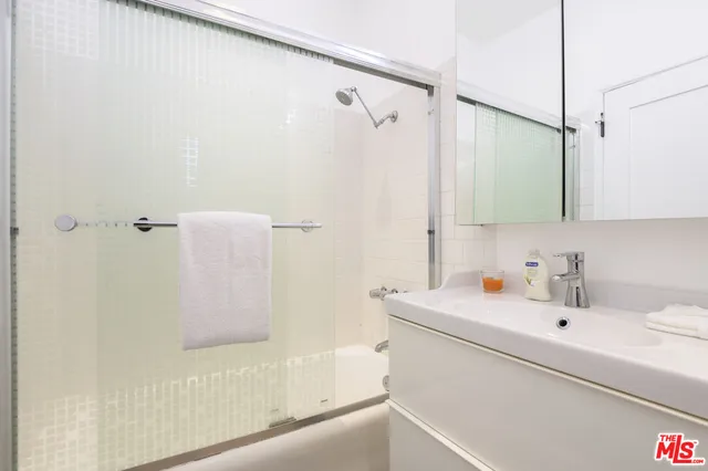 a bathroom with a sink and a shower