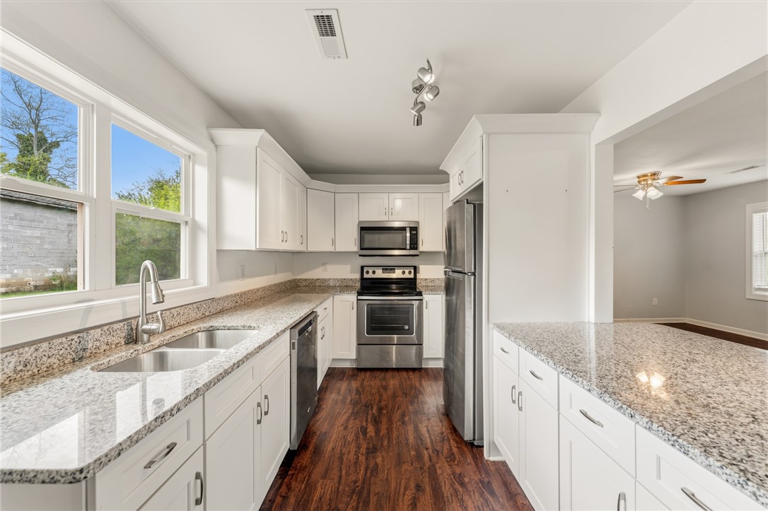104 Leah Drive Pendleton, SC 29670 - Photo 10 of 23 This bright kitchen features gleaming countertops, modern appliances, and a spacious layout for culinary endeavors.