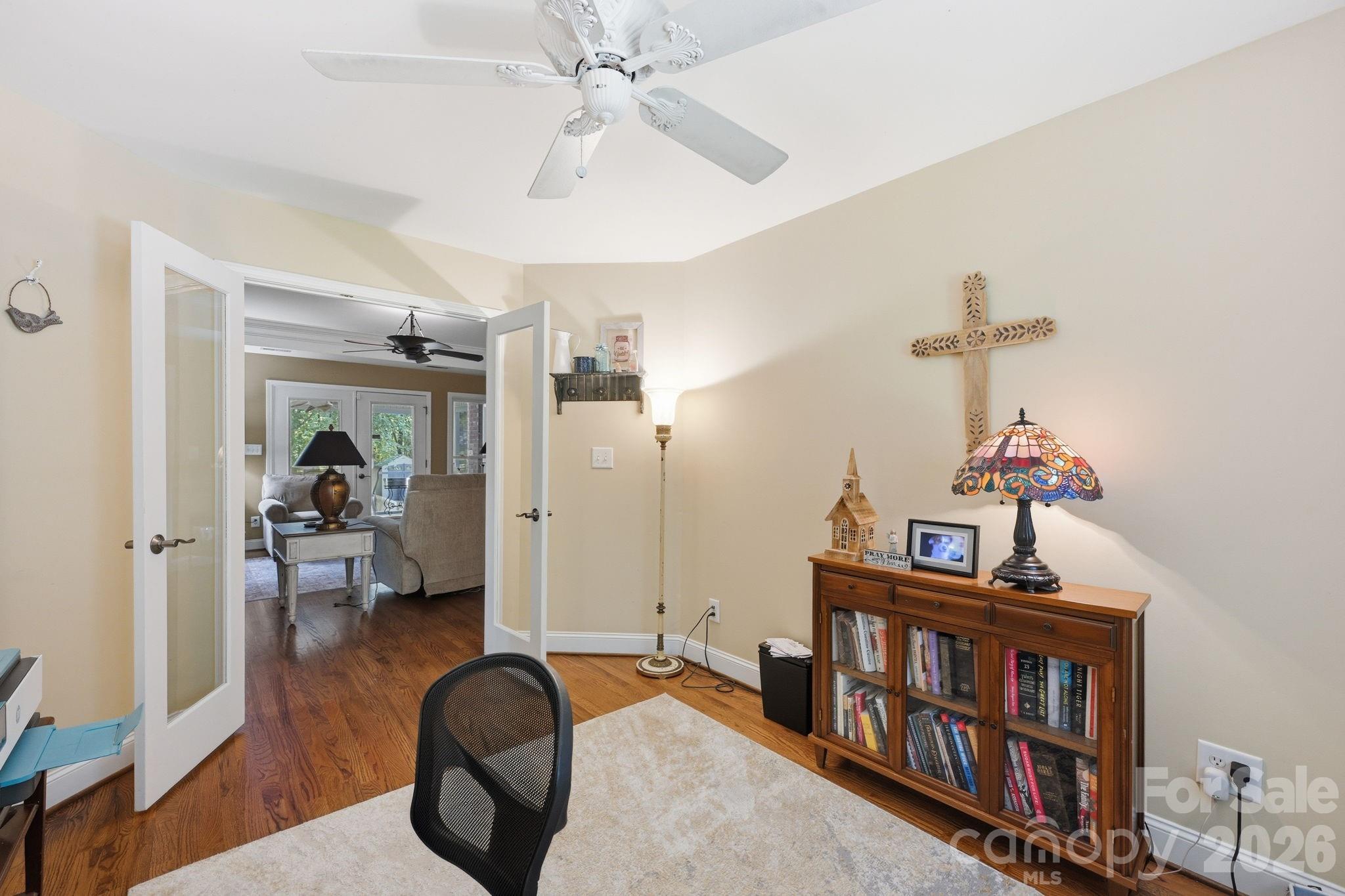 145 Upper Spencer Mountain Road Stanley, NC 28164 - Photo 12 of 29 a bedroom with furniture and a chandelier