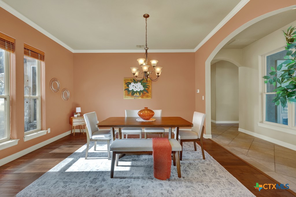 7607 Sky Loop Garden Ridge, TX 78266 - Photo 20 of 43 a dining room with furniture and window