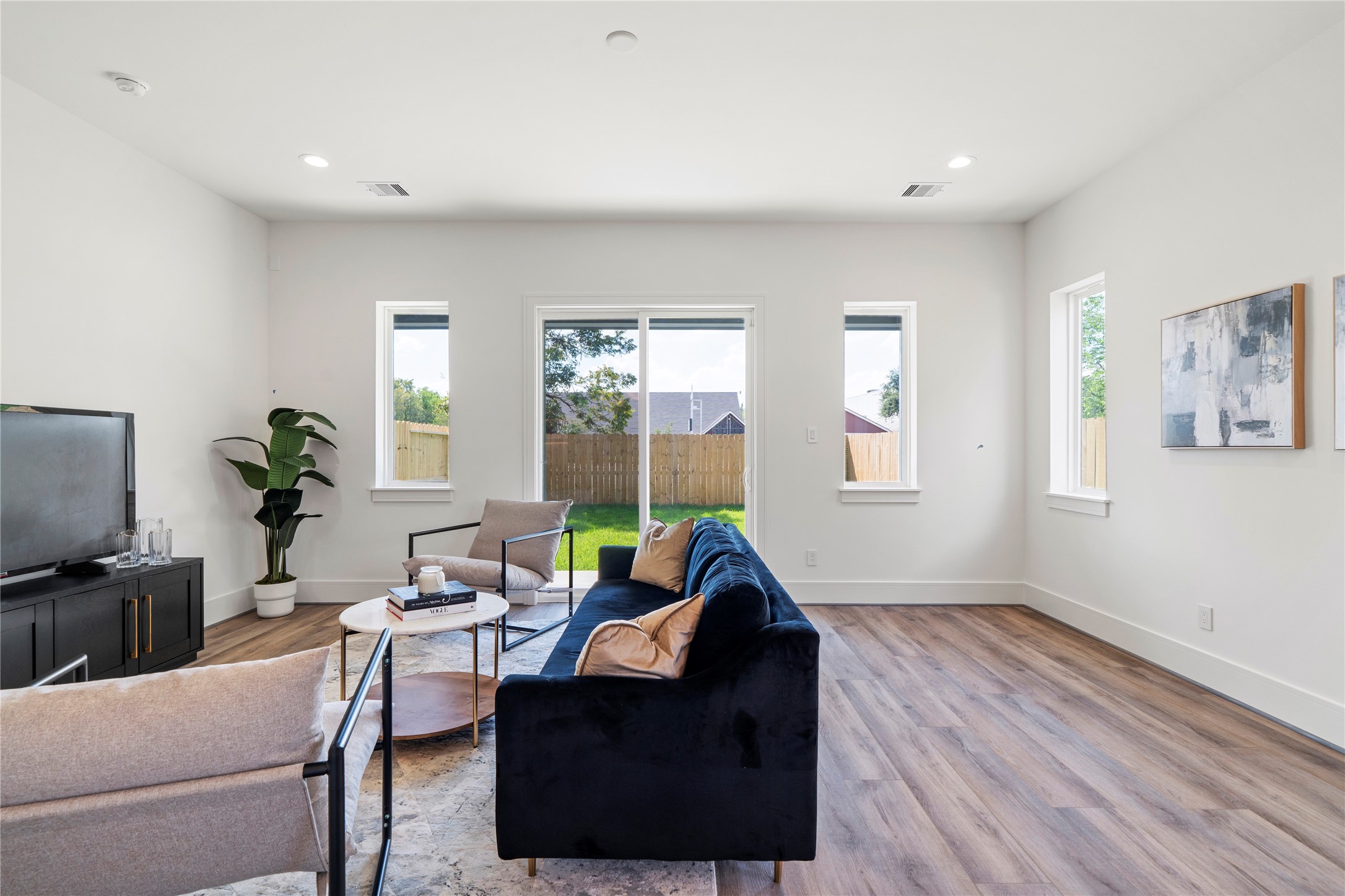 4218 Nichols Street Houston, TX 77020 - Photo 14 of 45 a living room with furniture a window and a flat screen tv