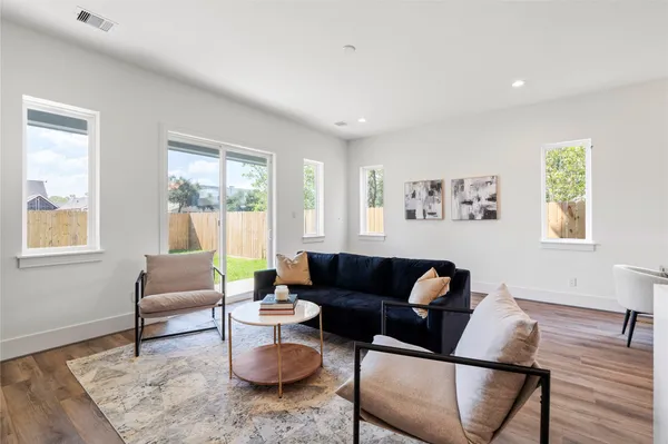 a living room with furniture and a window