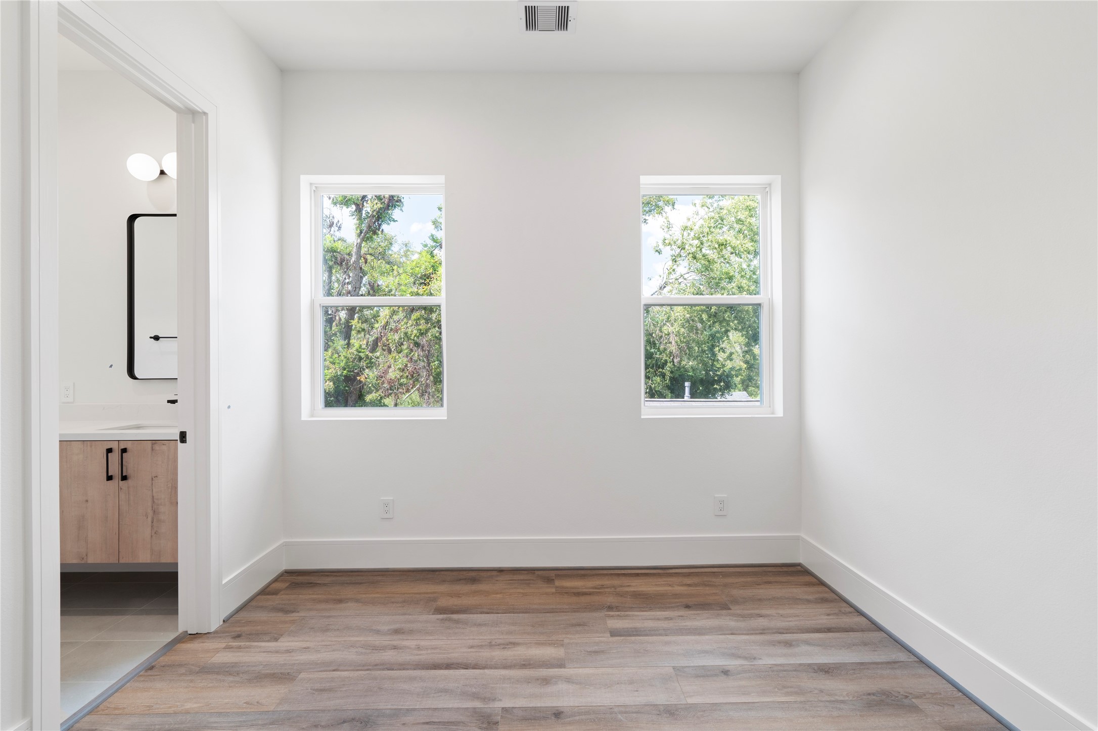 4218 Nichols Street Houston, TX 77020 - Photo 23 of 45 an empty room with window and wooden floor