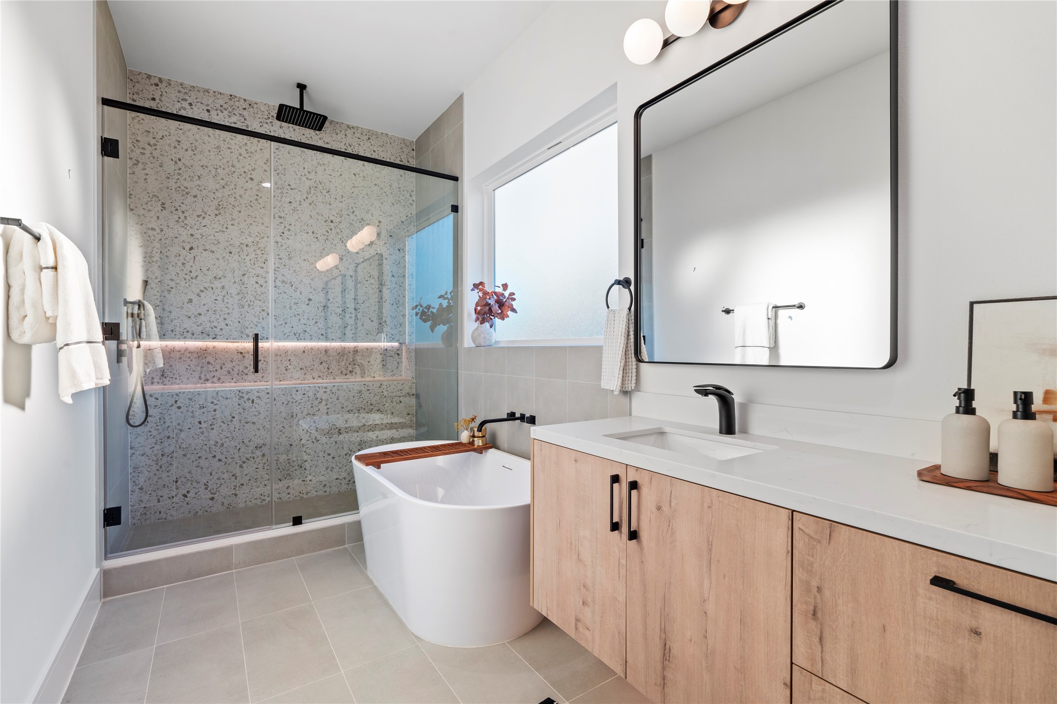 4218 Nichols Street Houston, TX 77020 - Photo 35 of 45 a bathroom with a double vanity sink a mirror and bathtub