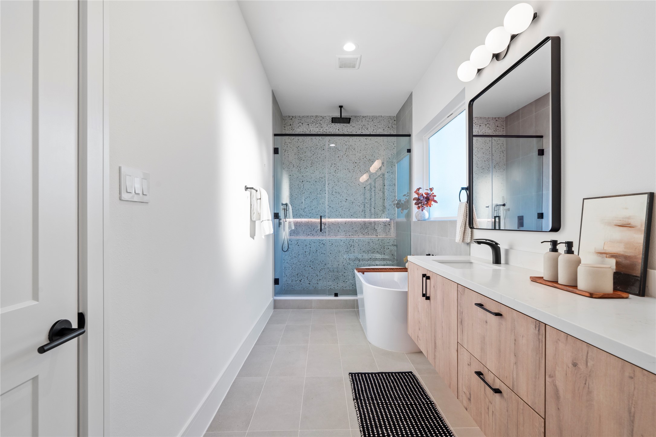 4218 Nichols Street Houston, TX 77020 - Photo 37 of 45 a bathroom with a double vanity sink toilet mirror and shower