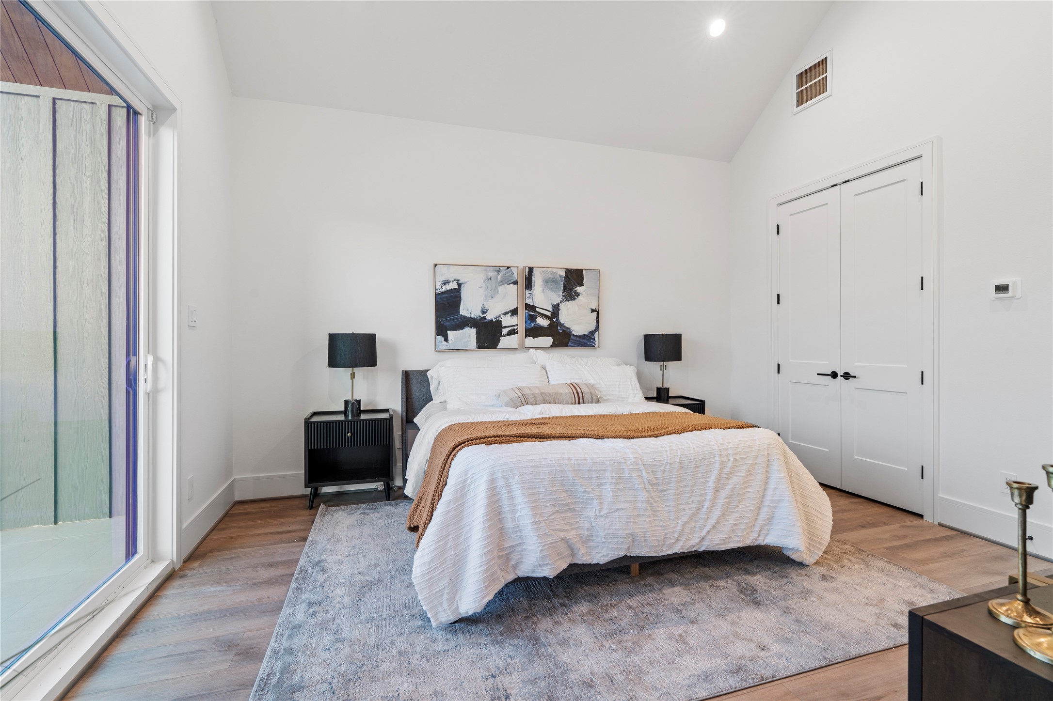 4218 Nichols Street Houston, TX 77020 - Photo 39 of 45 a bedroom with a bed and a potted plant on dresser