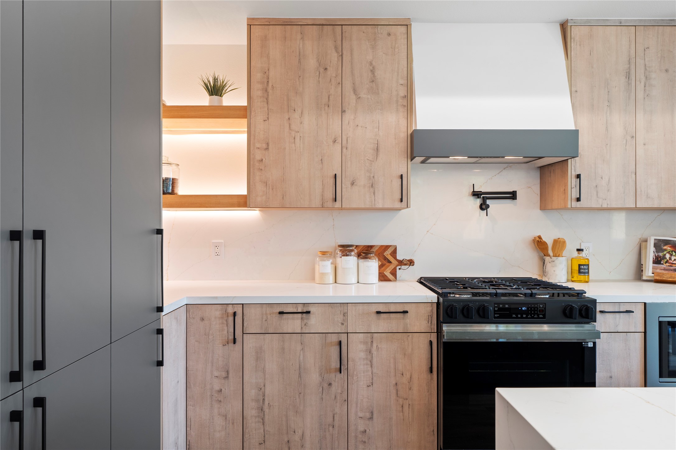 4218 Nichols Street Houston, TX 77020 - Photo 9 of 45 a kitchen with stainless steel appliances a stove a sink and a refrigerator