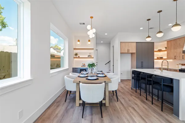 a view of a dining room with furniture and wooden floor