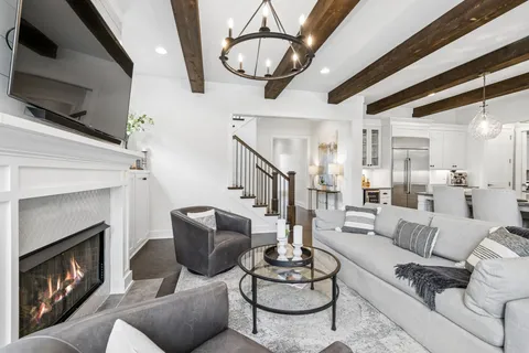 a kitchen with granite countertop a sink stainless steel appliances and cabinets