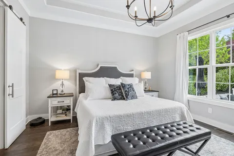 a living room with furniture a lamp and a ceiling fan